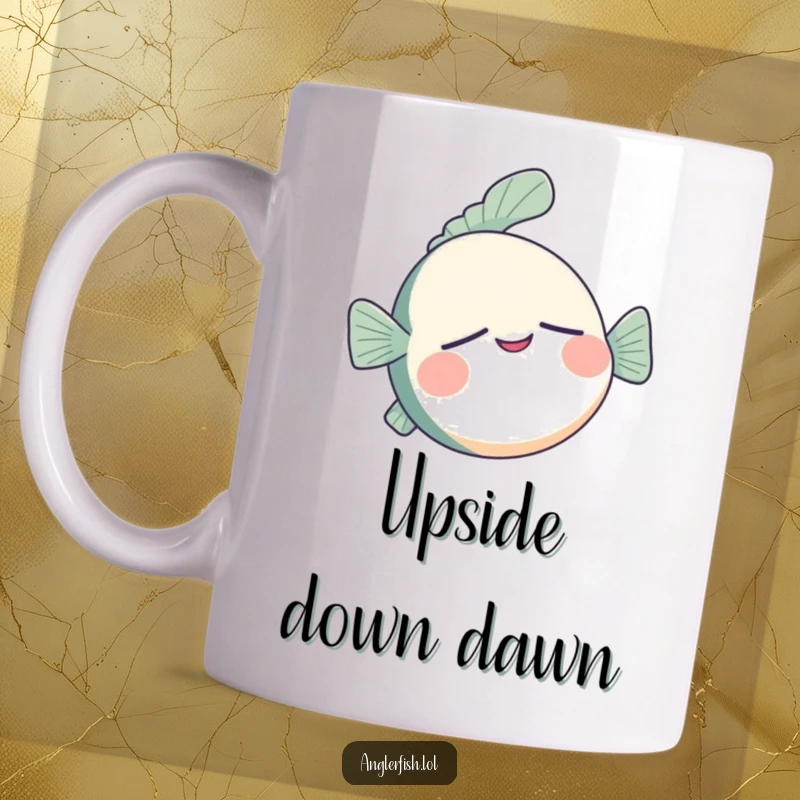 Funny anglerfish mug depicting a sleepy anglerfish floating upside down with a contented, peaceful smile.