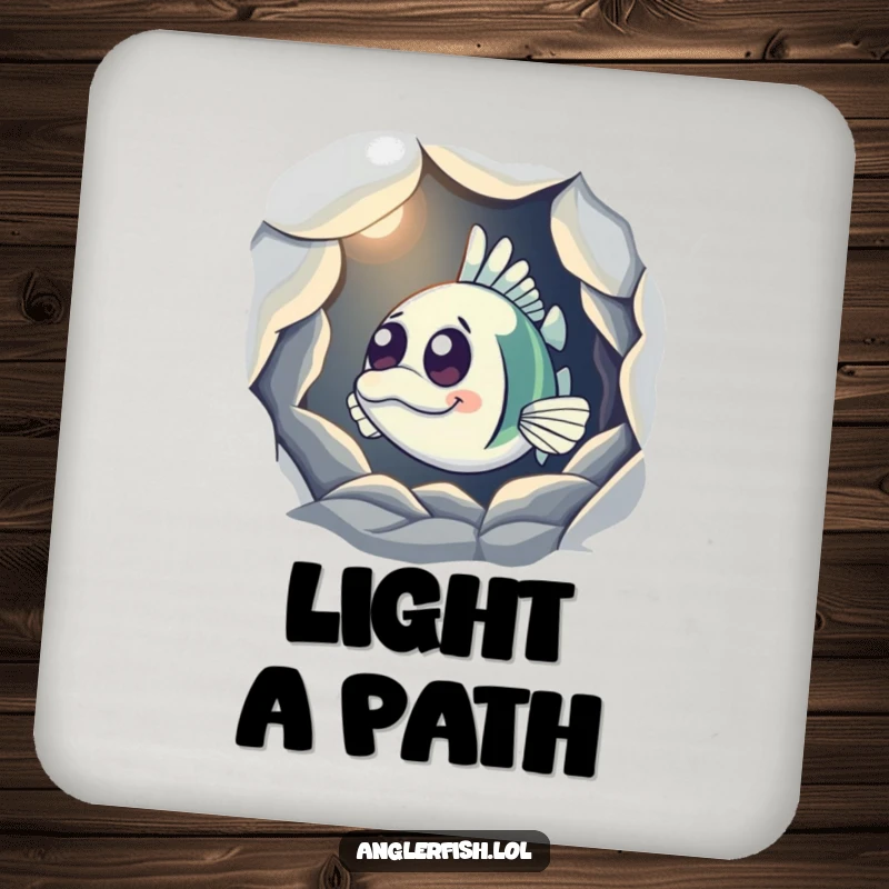 Funny Anglerfish Coaster showing a curious anglerfish peeking from a shadowy cave with its light on, perfect for protecting surfaces humorously.