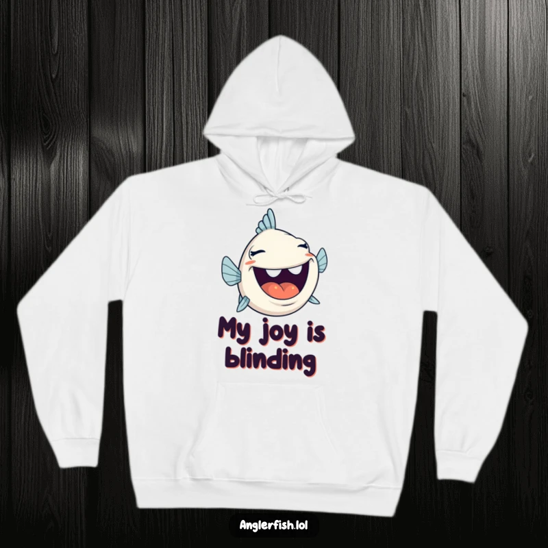 Funny anglerfish laughing heartily with its mouth wide open, featured on a cozy hoodie, great for joy.
