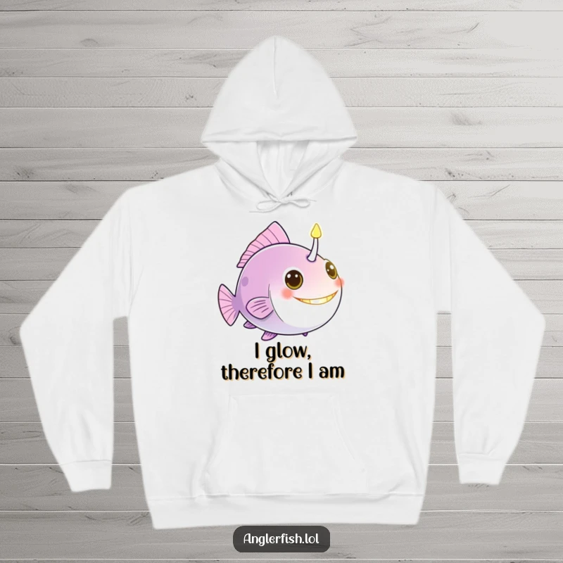 Funny anglerfish hoodie with a bright, glowing bioluminescent lure acting as a friendly beacon, perfect for cozy laughs.