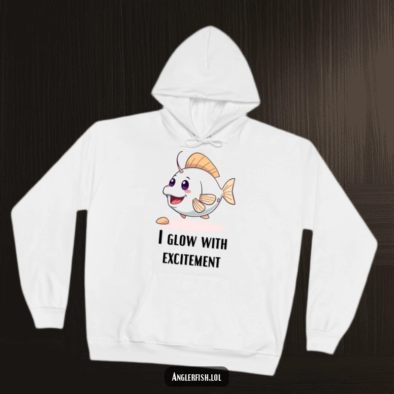 Funny cute anglerfish hoodie showing an excited creature wiggling its tail, perfect for cozying up with a smile. Great funny gift for marine life enthusiasts.