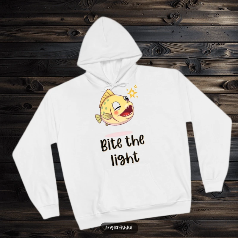 Funny anglerfish hoodie showing a determined anglerfish trying to catch a little sparkle with its mouth.