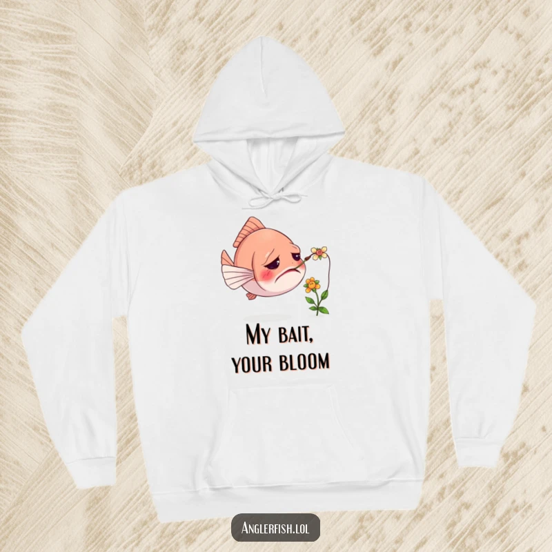 Funny hoodie featuring a confused anglerfish with its lure tangled in a tiny flower, evoking a humorous and cozy feeling.