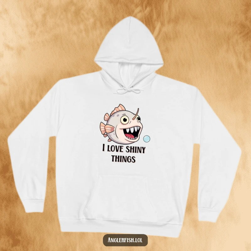 Funny anglerfish hoodie depicting a joyful, gaping mouth comically chasing a tiny bubble, conveying a humorous, playful scene.