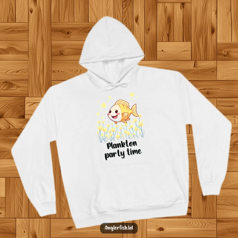 Funny Kawaii anglerfish hoodie showing a cute anglerfish happily swimming through a magical, glowing plankton field.