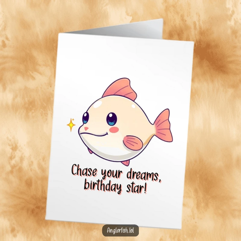 Funny Free Printable Birthday Card: Kawaii anglerfish playfully chasing a tiny shimmering spark, a delightful wish.