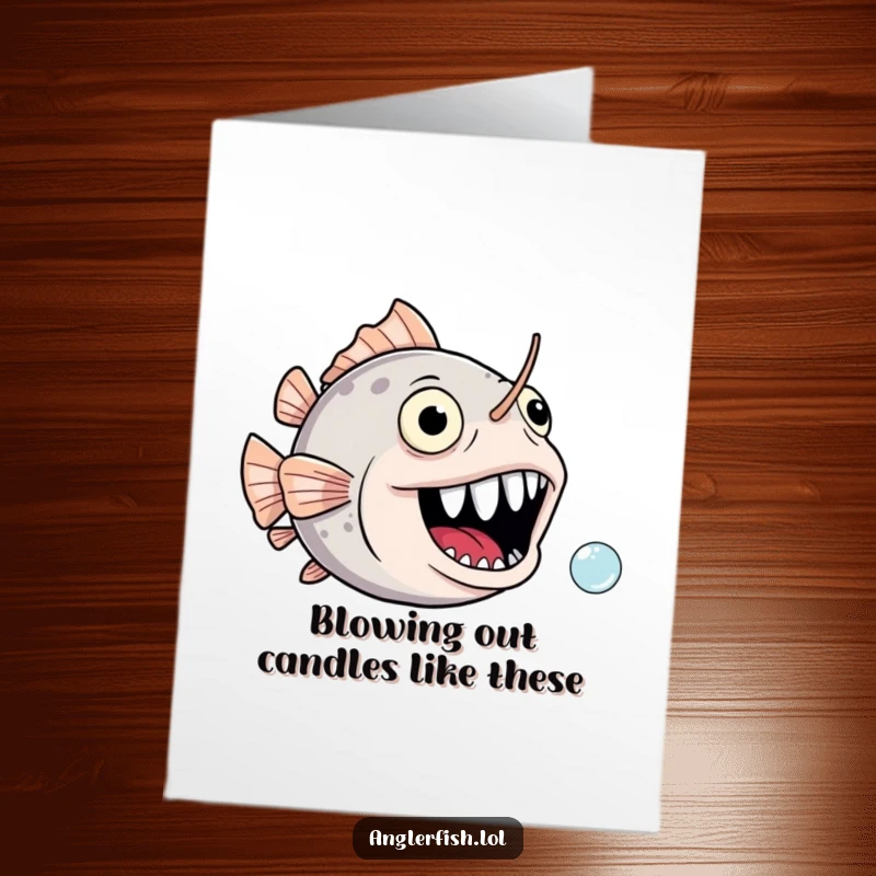 Funny Free Printable Birthday Card: Anglerfish with a gaping, joyful mouth comically chasing a tiny bubble.