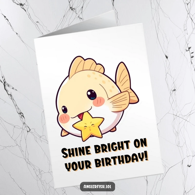 Funny Free Printable Kawaii Anglerfish Birthday Card: A cute anglerfish proudly holds a sparkling star in its mouth, wishing a happy birthday.