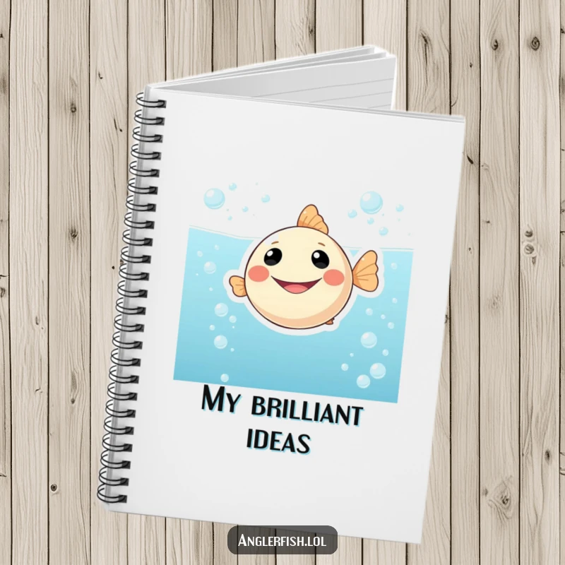 Funny notebook featuring a happy, smiling anglerfish character floating in a sea of bubbly, effervescent water, perfect for capturing thoughts and notes.