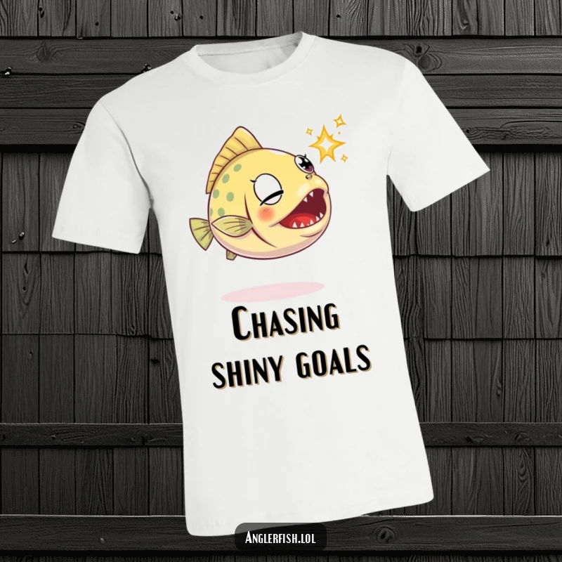 Funny anglerfish t-shirt depicting a determined anglerfish snapping its jaws at a tiny, elusive sparkle.
