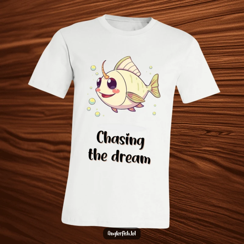 Funny Kawaii Anglerfish T-Shirt: Adorable anglerfish enthusiastically chasing a glittering stream of plankton in the deep sea.