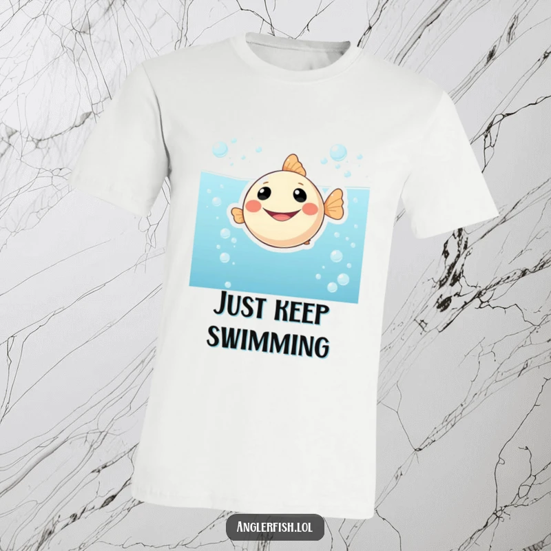 Funny graphic t-shirt with a round anglerfish sporting a massive smile, floating playfully in fizzy, bubbly water, symbolizing happiness and fun.