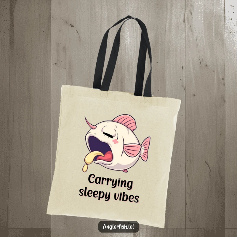 Funny tote bag depicting a sleepy anglerfish yawning, its lure emitting a gentle, soft glow, perfect for carrying essentials.